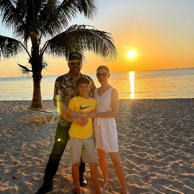 Photo of  Anni Krueger along with her husband , Charles Fredericks and her son Fenwick during vacation